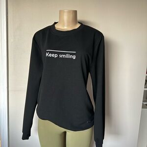 Keep smiling graphic pullover size small